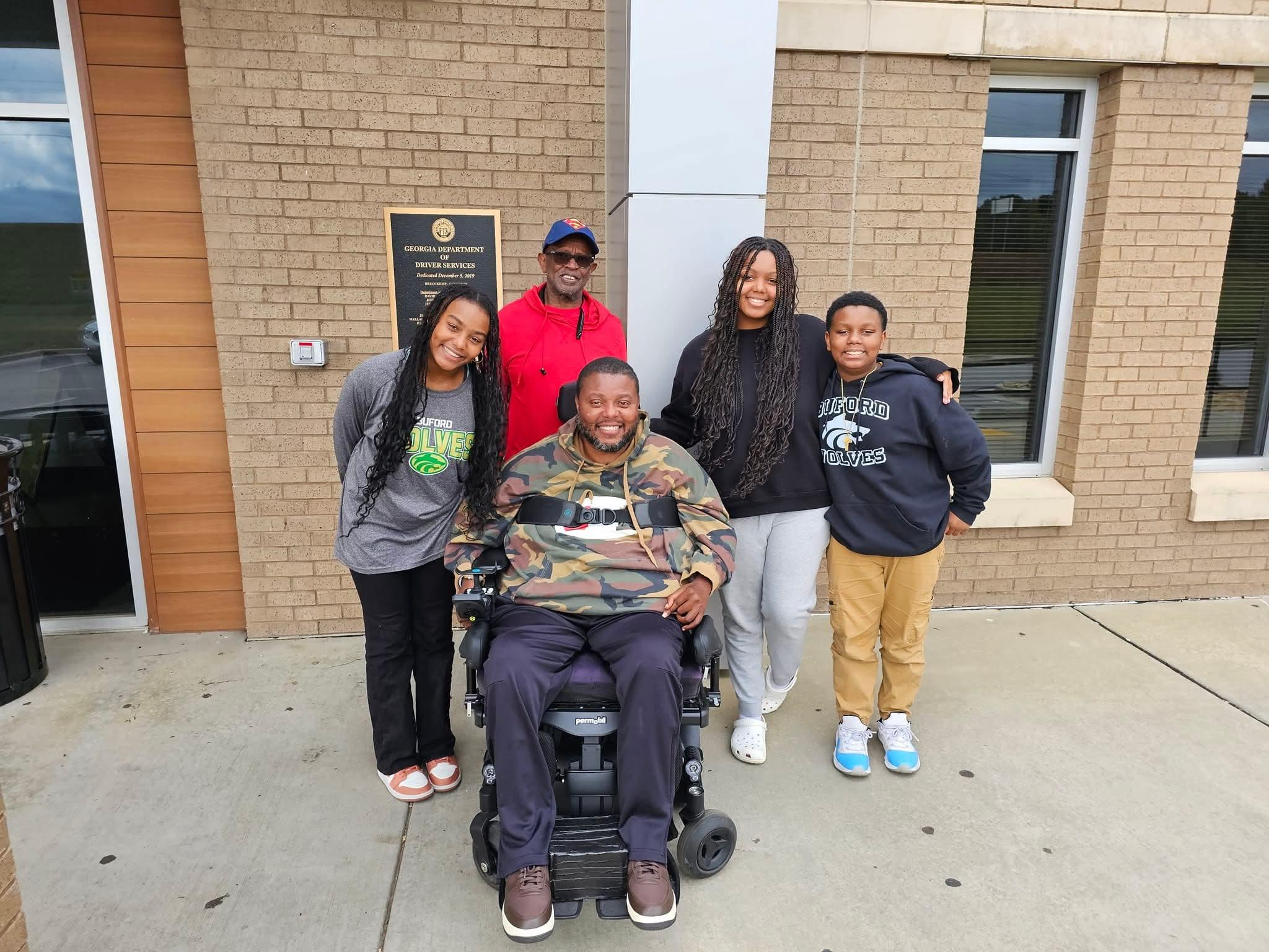 Lamont pictured with family members outside a public building
